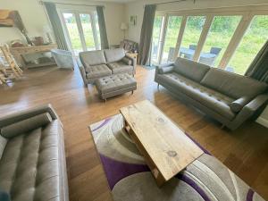 a living room with a couch and a coffee table at Meadow Shores - Part of the The Bay Filey Holiday Village with pool, gym and direct beach access, pub, restaurant, tennis and meadows walks in Filey