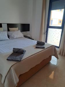 Ένα ή περισσότερα κρεβάτια σε δωμάτιο στο La Isla Bonita