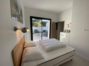 En eller flere senge i et værelse på La Villa de l Ancre Marine