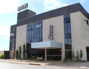 a building with a sign on top of it at Hotel Caribe in Porto Velho