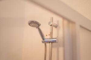 a blow dryer is attached to a wall at Sa Capannizza in Limpiddu +24 photos