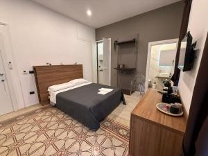 Postel nebo postele na pokoji v ubytování La Piazza Suite + 67 fotografií
