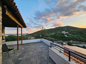 a balcony with a view of a mountain at Villa Kirki in Iraklitsa
