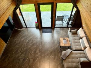an overhead view of a living room with a couch at VVV House in Avrig