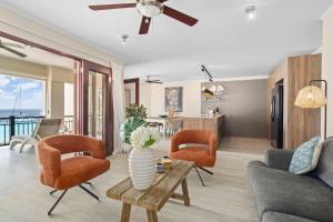 a living room with a couch and chairs and a table at Elegancia Ocean View with Cooling Pool in Kralendijk