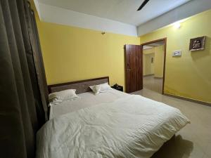 Postel nebo postele na pokoji v ubytování Homestay Inn