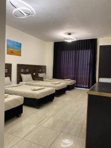 Postel nebo postele na pokoji v ubytování Eden Hotel