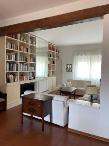 a living room with a couch and a table at La casa nel Borgo in Borgo San Lorenzo
