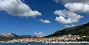 a group of boats are docked in a harbor at Studio Neven with Sea View in Baška
