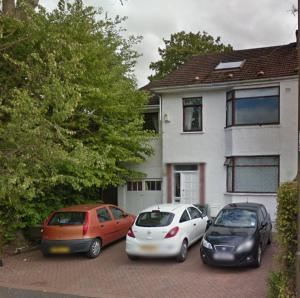 three cars parked in a parking lot in front of a house at Silverknowes in Edinburgh