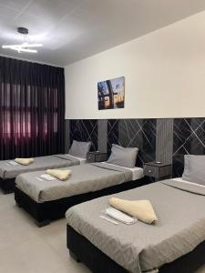 Postel nebo postele na pokoji v ubytování Eden Hotel