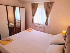 Postel nebo postele na pokoji v ubytování Apartman Adagio + 17 fotografií