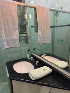 a bathroom with a sink and a mirror at STUDIO IPANEMA CONFORTÁVEL in Rio de Janeiro +22 photos