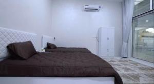 Giường trong phòng chung tại Two bedrooms - Waeb Holiday Home