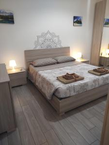 Postel nebo postele na pokoji v ubytování CAMARDA HOME + 30 fotografií
