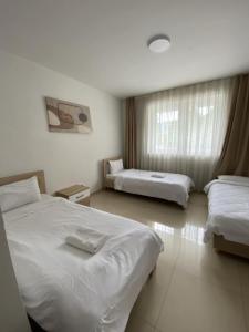 Postel nebo postele na pokoji v ubytování Hotel Kerchova - Kichevo