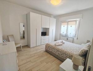 Posteľ alebo postele v izbe v ubytovaní Casa La Cartolina