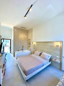 Postel nebo postele na pokoji v ubytování Terrazza Levante - Boutique rooms