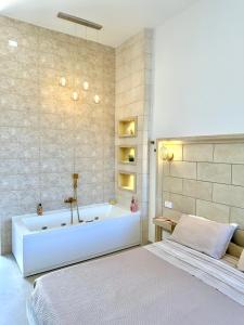 Postel nebo postele na pokoji v ubytování Terrazza Levante - Boutique rooms
