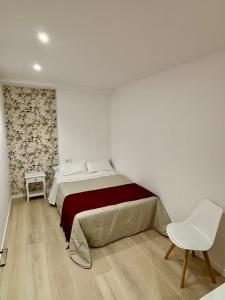 Katil atau katil-katil dalam bilik di Apartamentos do porto Malpica