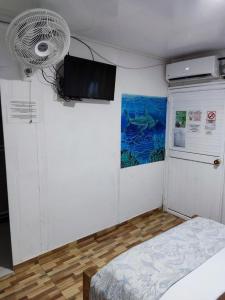 Uma TV ou centro de entretenimento em Posada San Nicolas