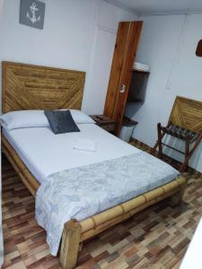 Postel nebo postele na pokoji v ubytování Posada San Nicolas