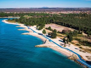 an aerial view of a beach in the water at Cozy room in Pula