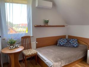 Postel nebo postele na pokoji v ubytování DorJan - Pokoje Gościnne