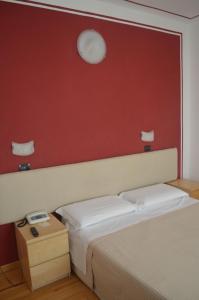 Postel nebo postele na pokoji v ubytování Hotel Paradiso