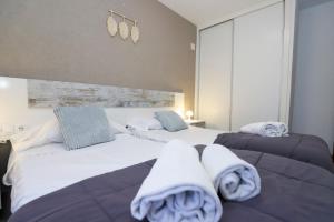 A bed or beds in a room at DIFFERENTFLATS Samoa