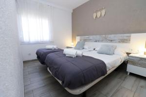 A bed or beds in a room at DIFFERENTFLATS Samoa
