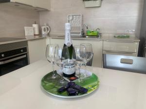 a bottle of wine and two wine glasses on a table at VILOTE Lanzarote in Tías