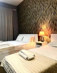 Postel nebo postele na pokoji v ubytování Hotel 6