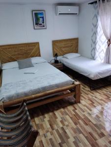 Cama ou camas em um quarto em Posada San Nicolas