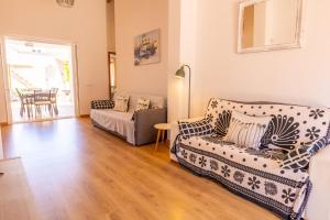 A bed or beds in a room at Casa Embat, a pocos metros de la playa