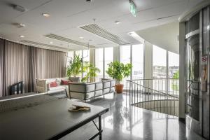 a living room with a couch and a table at Best Western Plus Sthlm Bromma in Stockholm