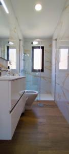 a bathroom with a tub and a sink at Casa Praia Norte II - PVZ in Póvoa de Varzim