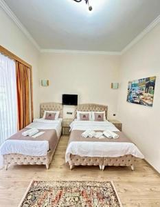 Postel nebo postele na pokoji v ubytování elegance famıly house