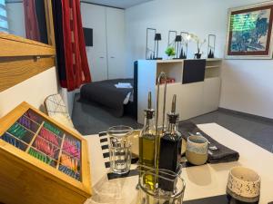 a room with a table with wine bottles on it at Bergblick Studio I Flims I Laax I Ski I Caumasee in Flims