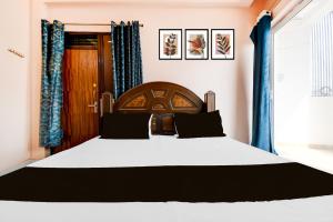 En eller flere senge i et værelse på Hotel O Valencia Stay