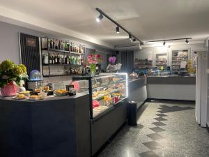 a restaurant with a display case filled with food at Caffetteria dell'Angolo in Borghetto Secondo