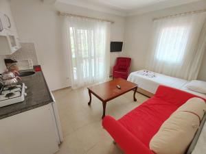 A kitchen or kitchenette at Bucak Apart Hotel Göcek & Beach