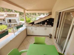 A balcony or terrace at Bucak Apart Hotel Göcek & Beach