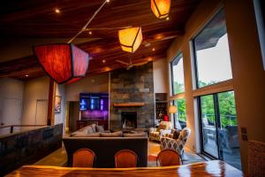 a living room with a couch and a fireplace at 4BR - 2 Mstr Suites, Hot Tub, Prime Views, Privacy in Waitsfield +125 photos