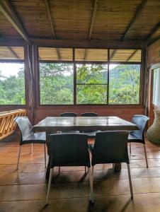 a dining room with a large table and chairs at Pungara Eco-Lodge in Tena +58 photos