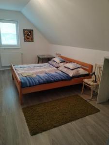 Postel nebo postele na pokoji v ubytování Domček Michal