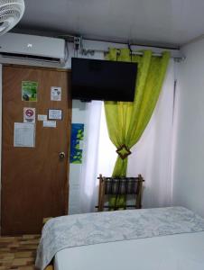 Cama ou camas em um quarto em Posada San Nicolas