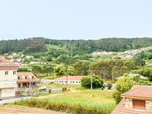 a view of a village with houses and trees at Apartamento Máis by ALÔGA in Fisterra +4 photos