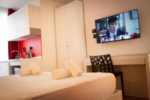 Postel nebo postele na pokoji v ubytování Citizen Suites