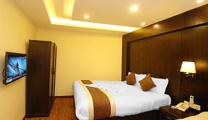 Voodi või voodid majutusasutuse Kathmandu Grand Hotel toas